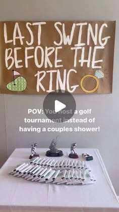 a table topped with lots of silverware next to a sign that says last swing before the ring