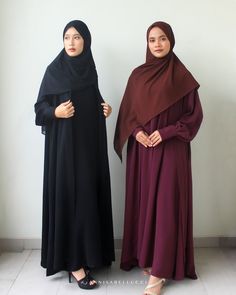 Elegant day to night abaya featuring bishop sleeves with wrap button cuffs complete with invisible side pockets. Made for the long haul, this abaya comes with a sleeveless underdress and matching hijab. FABRICATION 100% Polyester Hijab: Chiffon Hand Wash Cold Delicate Separately COLOR Jet Black, Burgundy SIZE AND FIT Model wears size S Model: 165cm/5'5 PRODUCT DETAILS Centre front eye-hook closure  Shipping from Indonesia If you have any questions, please send us a message in Etsy conversations. Traditional Long Niqab For Eid, Long Niqab For Eid, Long Niqab With Dabka For Eid, Long Dabka Niqab For Eid, Solid Long Thobe For Eid, Long Thobe For Eid, Traditional Maxi Length Khimar With Dabka, Traditional Floor-length Khimar With Dabka, Solid Long Niqab For Eid