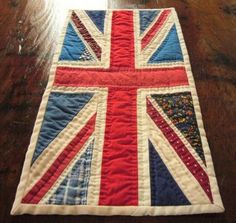 a quilted union jack on a wooden table