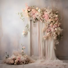 an artistic photo with flowers and feathers on the floor next to a white framed mirror