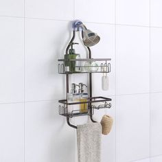 a bathroom with a towel rack and soap dispenser