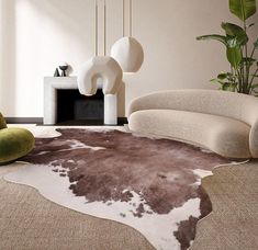 a living room with a cow hide rug on the floor