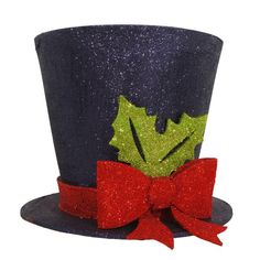 a black top hat with holly leaves and red bow tie on it's side