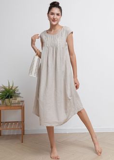 "Smock linen dress featuring in round neckline, pleated waist details, casual loose silhouette. ★★FEATURES 100% Linen Two side pockets Round neckline Short sleeve Pleated waist details Casual dress Mama dress Simple dress Perfect for Summer, Spring ★★ Model Size Height approx 162 cm (5′ 4″) Bust 84 cm (33\") Waist 66 cm (26\") She wears size XS. ★★ Bespoke Order Service If you Request other color Request the length Your height is not between 155 cm- 172 cm Your weight is over 75 kg I can do it f Casual Linen Plain Dress, Casual Pleated Linen Dress For Summer, Casual Linen Pleated Dress, Casual Flax Dress For Daywear, Casual Flax Daywear Dress, Casual Flax Color Dress For Daywear, Casual Flax Color Daywear Dress, Casual Beige Dress, Dresses For Short Curvy Figures