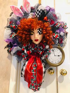 a red headed woman with curly hair and makeup is hanging on a door handle next to a clock