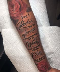 a person with a rose tattoo on their arm that says, for i reason that the sufferings of this present time are not worth to be completed with glory