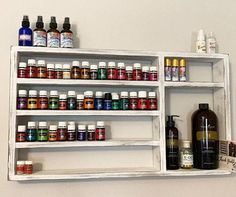 a shelf filled with lots of different types of medicine bottles on top of each other