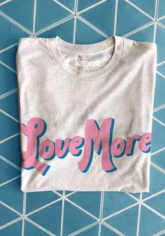 Love More Tee by kaeraz | Girl Gang Tees | Vintage Style Shirts | Retro Tshirts Slogan Tees Women, Womens Graphic Tees Vintage, Hippy Gifts, Graphic Tees Vintage, Slogan Tee, Love More, Design Concepts, Trendy Tee, 로고 디자인