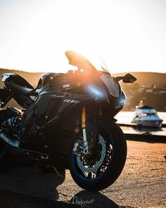 the motorcycle is parked on the side of the road