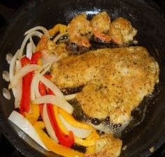 chicken and vegetables cooking in a skillet on the stove