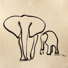 an elephant and its baby are drawn on paper