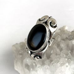 Large onyx ring sterling silver, black gemstone ring goth ring Black crystal ring made in Armenia gifts for women Handmade silver ring with natural black onyx. The ring is large and has a unique look! The free size of this ring lets you give a gift without knowing the size of finger) Also, All our pieces have the perfect design, modern look, and best quality ▶Ring weight: 18.53 gr ▶Length: 45 mm ▶Width: 25 mm All our jewelry is made of high-quality sterling silver and is stamped with a 925 stamp Elegant Handmade Black Rings, Gothic Sterling Silver Jewelry, Mystical Black Ring As Gift, Unique Black Sterling Silver Rings, Unique Black Rings With Polished Finish, Unique Black Promise Ring, Unique Black Ring Jewelry, Unique Onyx Gemstone Rings, Elegant Black Jewelry With Large Stone