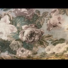 an upholstered fabric with flowers on it