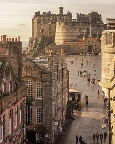 people are walking around in an old city