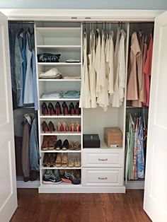 an organized closet with white drawers and shelves