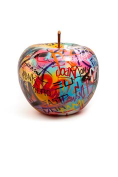 an apple covered in lots of colorful graffiti