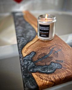 a candle sitting on top of a wooden table