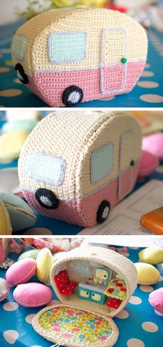 a crocheted toy bus sitting on top of a table next to other toys