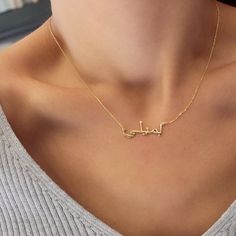 100% real. It's not plated  Here is a dainty, delicate and simple, yet classy minimalist 14K Solid Gold Arabic  Name  Necklace. The perfect gift for yourself and your  loved ones This is 14k Solid Gold. (you may see the 14k stamp available on the chain)   Features [] Made to Order [] Material Option: 14K Solid Gold (Both Name and the Chain) []Dimensions: Depending on your font choice, height sizes range from 10mm to 6mm lowercase. [] Color Options: 14kYellow Gold-14KWhite Gold Gold Name Necklace Arabic, Name Chains Necklace Gold, Arabic Name Necklace Gold, Name Necklace Arabic, Arabic Name Necklace, Jewelry Necklace Simple, Arabic Necklace, Classy Minimalist, Silver Name Necklace