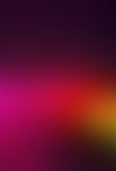 a blurry image of an orange, pink and yellow background with the color red