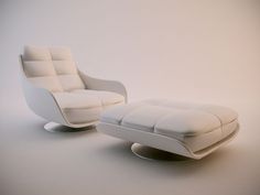 a white chair and ottoman sitting next to each other