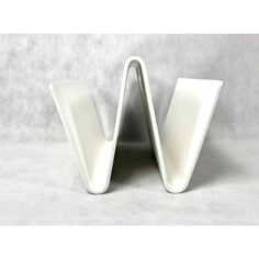 two white vases sitting on top of each other