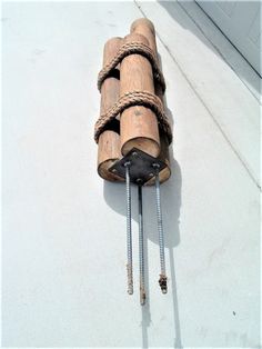 a wooden object with ropes attached to it