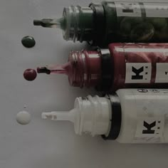 three different types of medicine bottles on a white surface