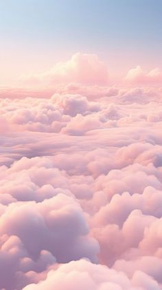 the sky is filled with lots of white clouds and pink hues in this photo