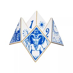 a blue and white clock with an animal on it's face in the center