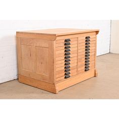 a wooden cabinet with many drawers on it