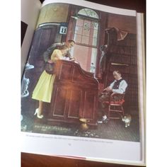 an open book showing a man and woman at a piano