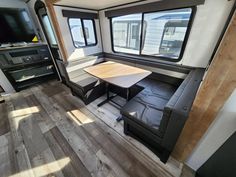 the interior of an rv with wood flooring