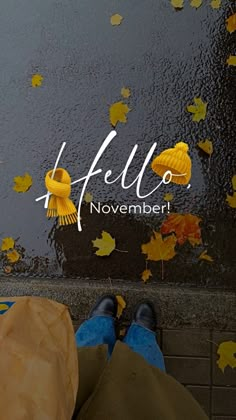 the feet of a person who is standing in front of a puddle with yellow leaves on it