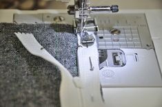 the sewing machine is stitching fabric on the side of the quilter's piece