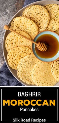 a plate with crackers and honey on it next to the words bahrir moroccan pancakes