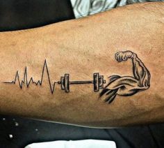 a man with a tattoo on his arm holding a barbell and heart beater