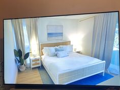 a flat screen tv sitting on top of a wooden shelf next to a bed in a bedroom