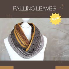 a white mannequin wearing a gray and yellow striped scarf with the words falling leaves on it