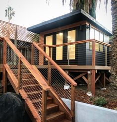 a small house with stairs leading up to it