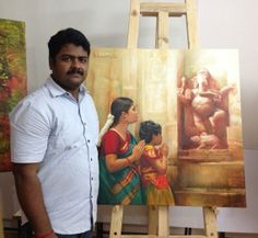 a man standing next to an easel with paintings on it