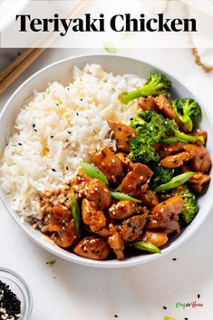 a white bowl filled with chicken and broccoli on top of rice next to chopsticks