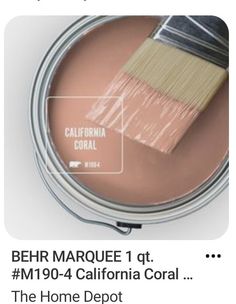 a paint can with a brush in it and the caption reads behr marquee 1 at m904 - 4 california coral