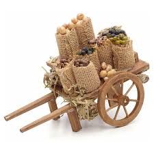 an old wooden wagon filled with lots of nuts and other things on it's wheels