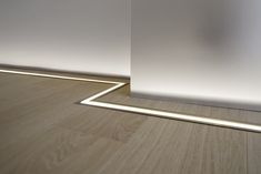 an empty room with white walls and wood flooring is shown in this 3d image