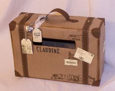 a brown suitcase with tags attached to it