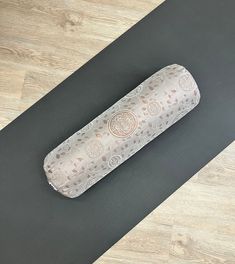 a yoga mat with a rolled up roll on it