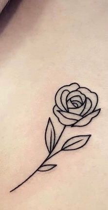 a small rose tattoo on the chest