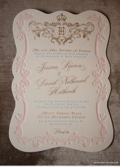 an ornate wedding card with pink and gold trimmings on the inside of it