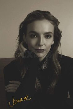 a black and white photo of a woman with long hair